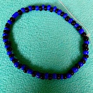 Black and blue bead bracelet made by me with stretchy cord